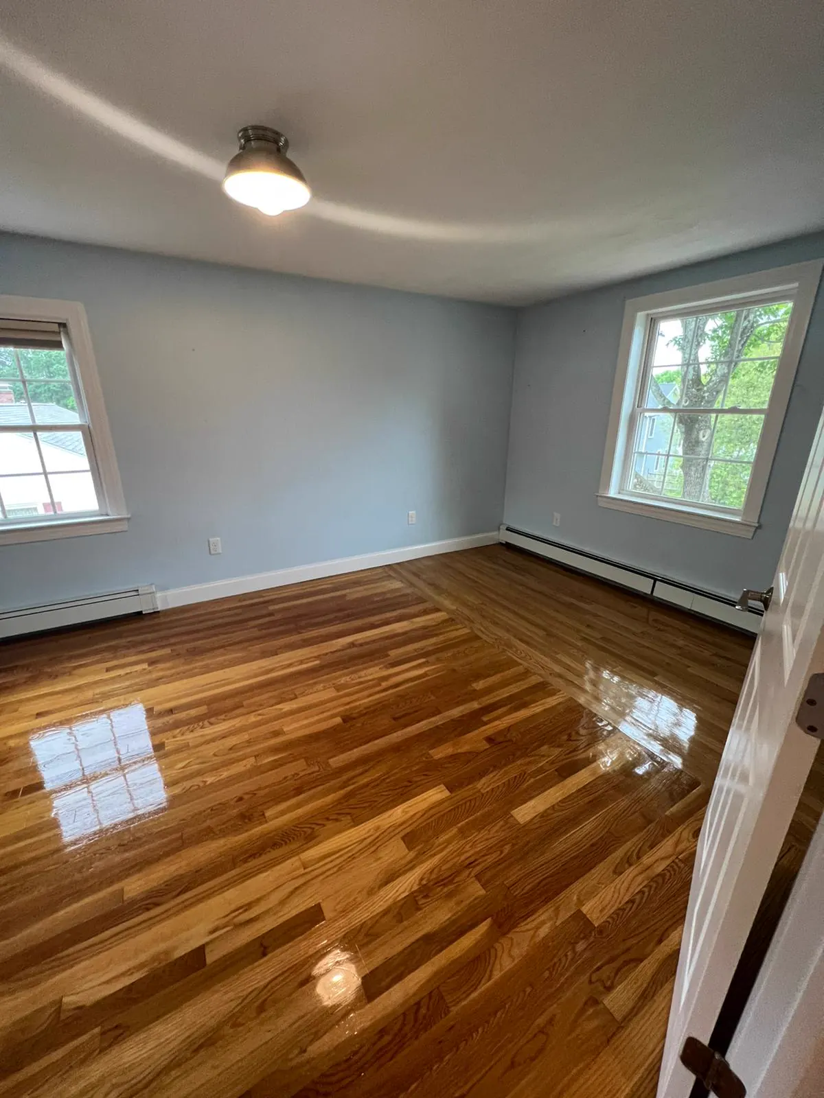Real hardwood floor cleaned by TouchShine